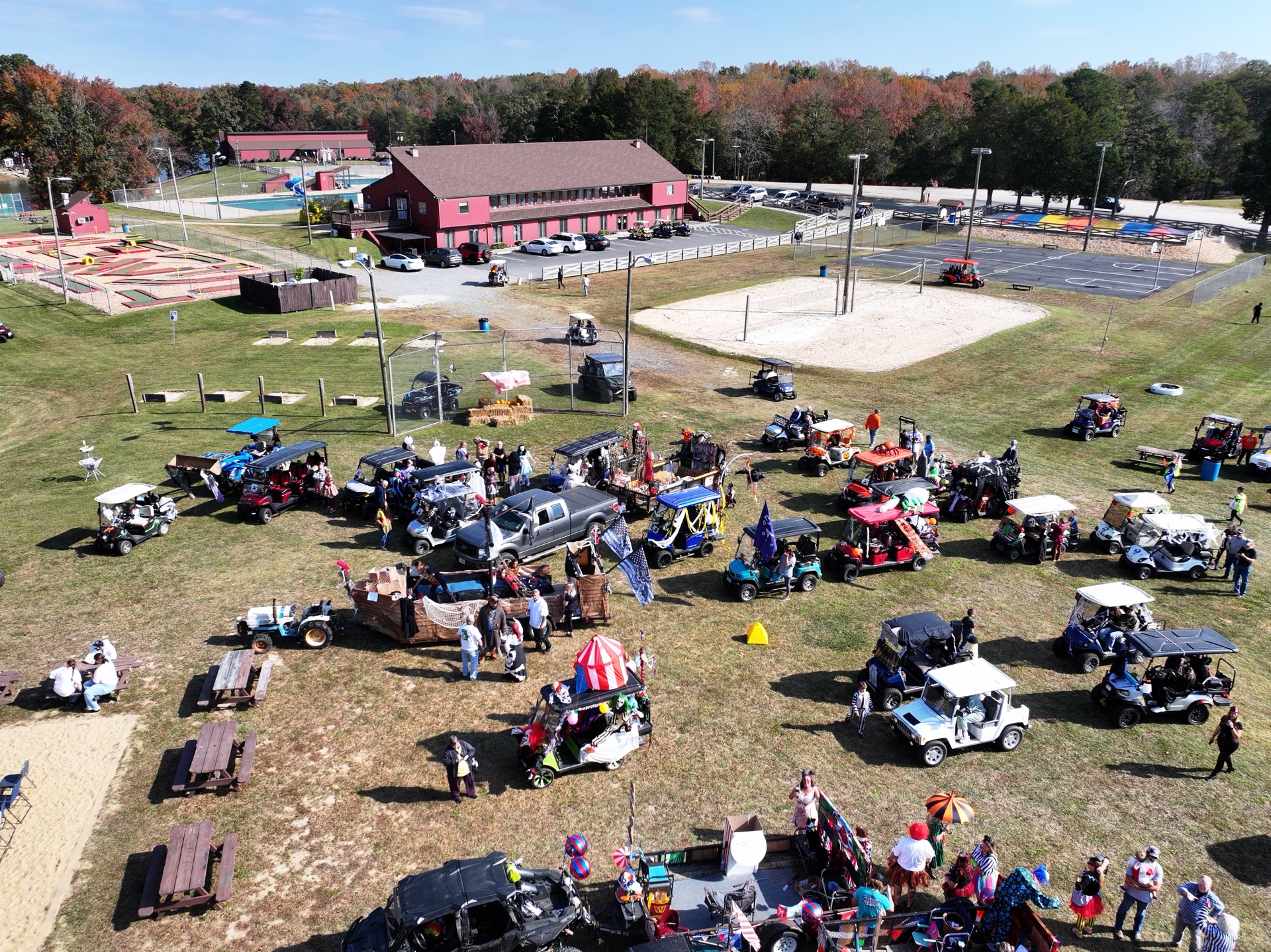 Aerial view showing clubhouse, mini golf, and volleyball courts