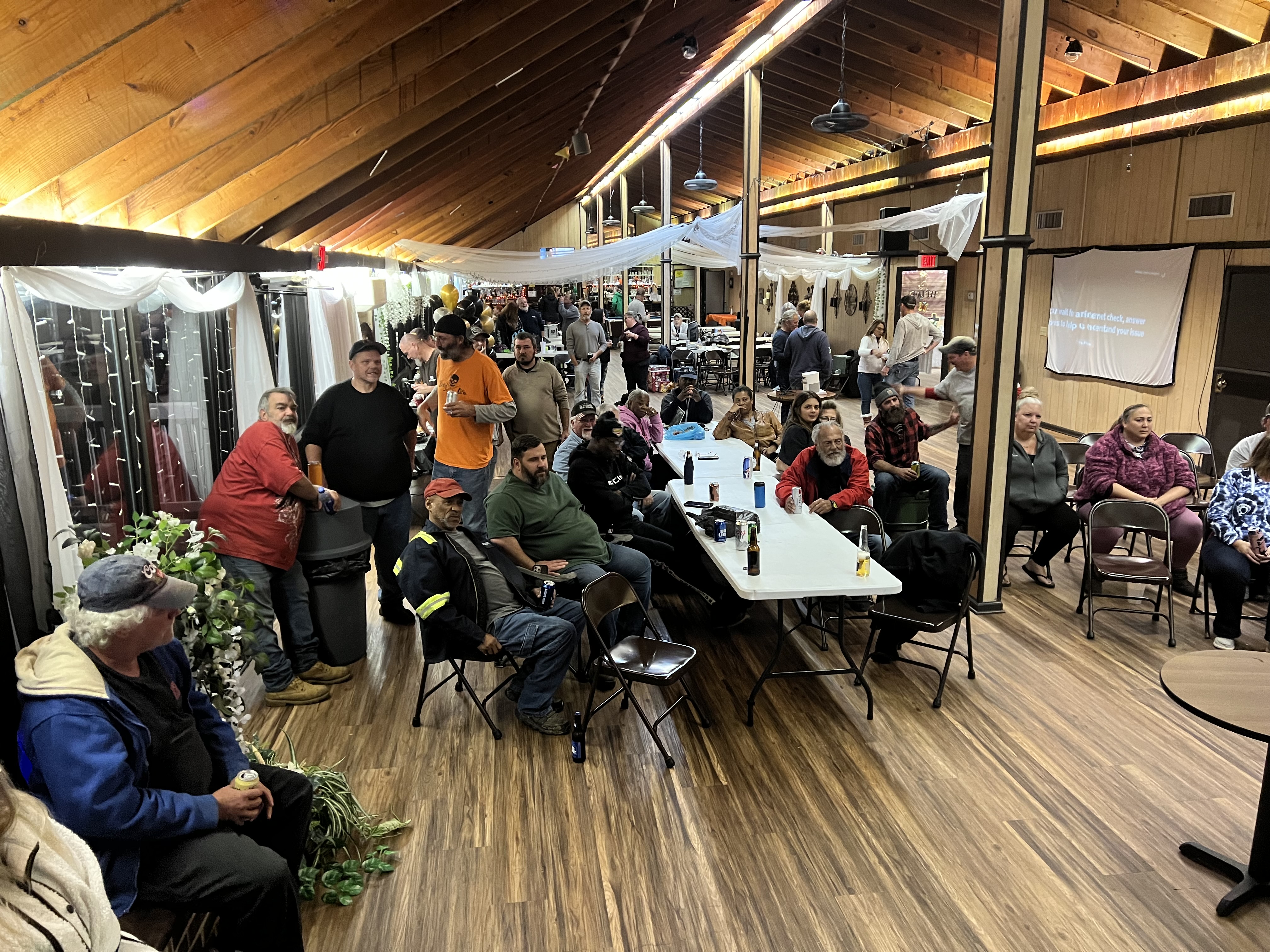 Indian Acres clubhouse filled with members at a community event